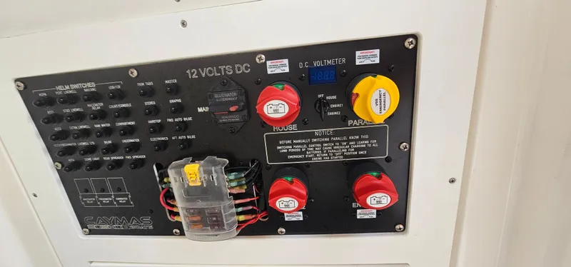  Yacht Photos Pics Control panel of 2023 Caymas 28 HB Twin boat with switches and voltmeter.