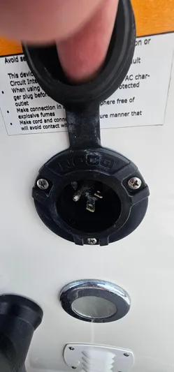  Yacht Photos Pics Power outlet on 2023 Caymas 28 HB Twin boat, close-up view.