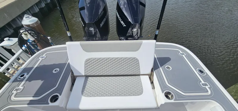  Yacht Photos Pics 2023 Caymas 28 HB Twin boat with dual Mercury engines, docked by the water.