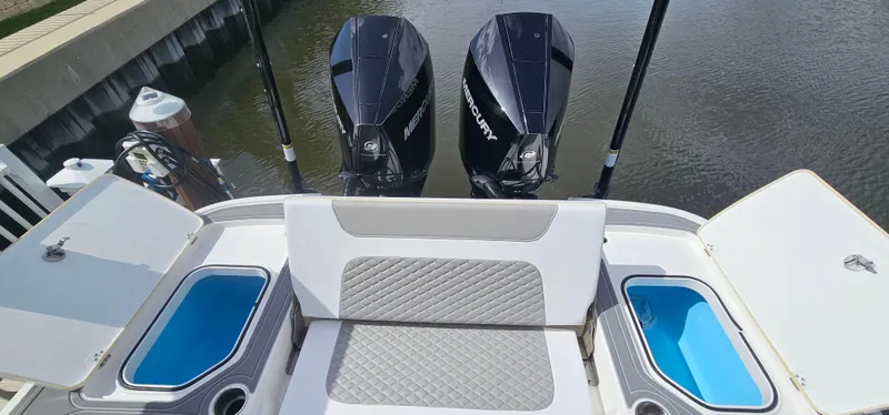  Yacht Photos Pics 2023 Caymas 28 HB Twin boat with dual Mercury engines and cushioned seating.