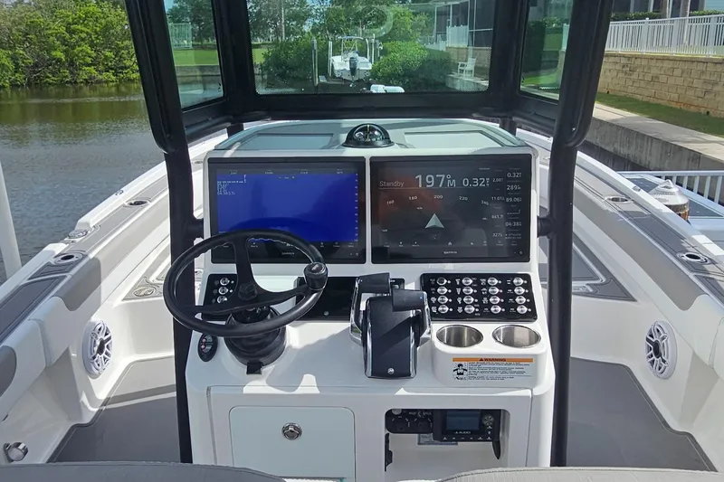  Yacht Photos Pics 2023 Caymas 28 HB Twin boat dashboard with advanced navigation and control systems.