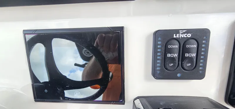  Yacht Photos Pics Control panel of 2023 Caymas 28 HB Twin with Lenco trim tab switches.