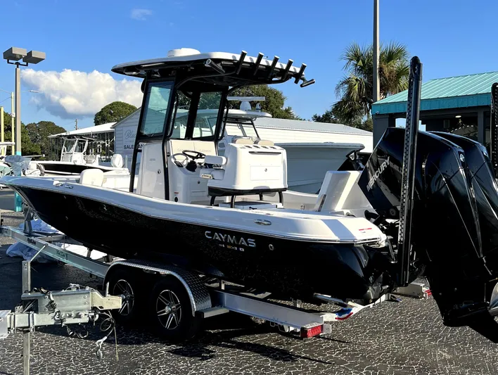  Yacht Photos Pics 2023 Caymas 28 HB Twin boat on trailer, displayed outdoors.