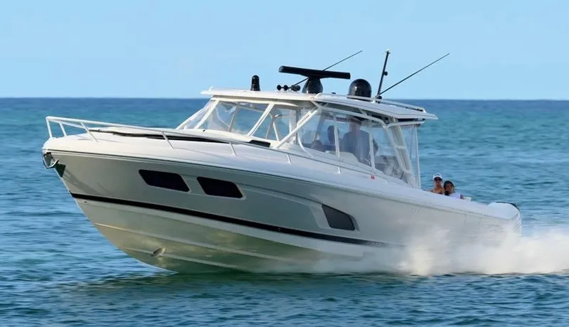  Yacht Photos Pics 2021 Intrepid 409 Valor cruising on open water, showcasing sleek design and performance.