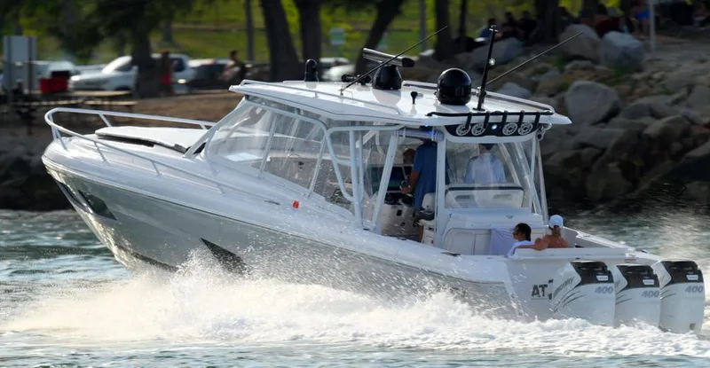  Yacht Photos Pics 2021 Intrepid 409 Valor boat cruising on water with powerful engines.