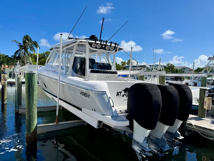  Yacht Photos Pics 2021 Intrepid 409 Valor boat docked with triple outboard engines.