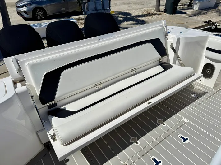  Yacht Photos Pics 2021 Intrepid 409 Valor boat with foldable seating on deck.