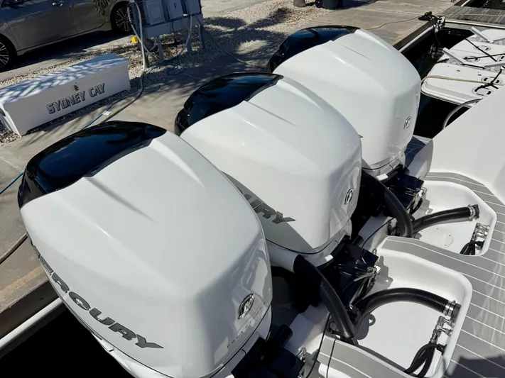  Yacht Photos Pics Triple Mercury outboard engines on a 2021 Intrepid 409 Valor boat at dock.