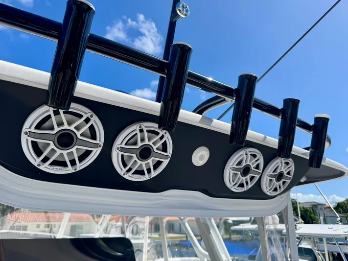  Yacht Photos Pics 2021 Intrepid 409 Valor boat speakers and rod holders under clear blue sky.