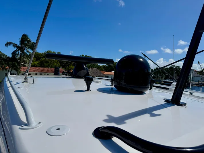  Yacht Photos Pics Intrepid 409 Valor 2021 boat deck with radar and clear blue sky.