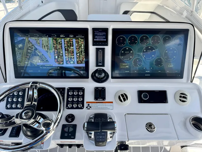  Yacht Photos Pics Intrepid 409 Valor 2021 dashboard with dual screens and navigation controls.