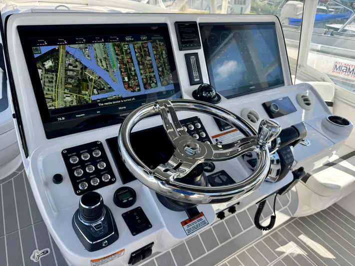  Yacht Photos Pics 2021 Intrepid 409 Valor helm with advanced navigation system and controls.