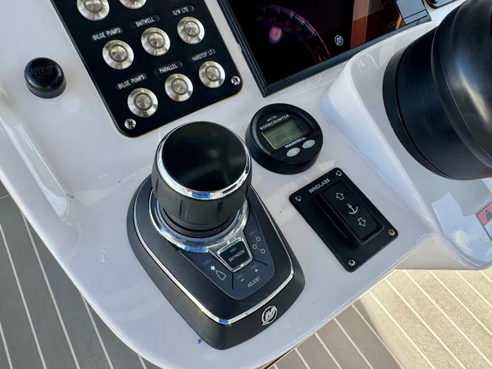 Yacht Photos Pics Control panel of 2021 Intrepid 409 Valor boat with joystick and digital display.