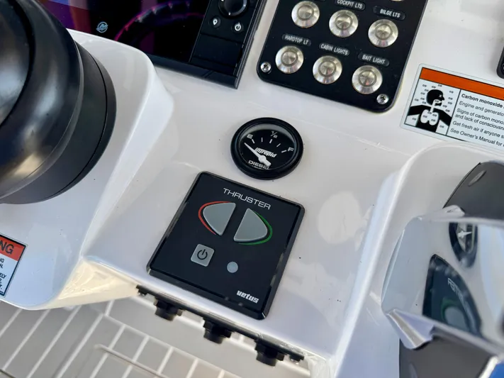  Yacht Photos Pics Control panel of a 2021 Intrepid 409 Valor boat with thruster controls.