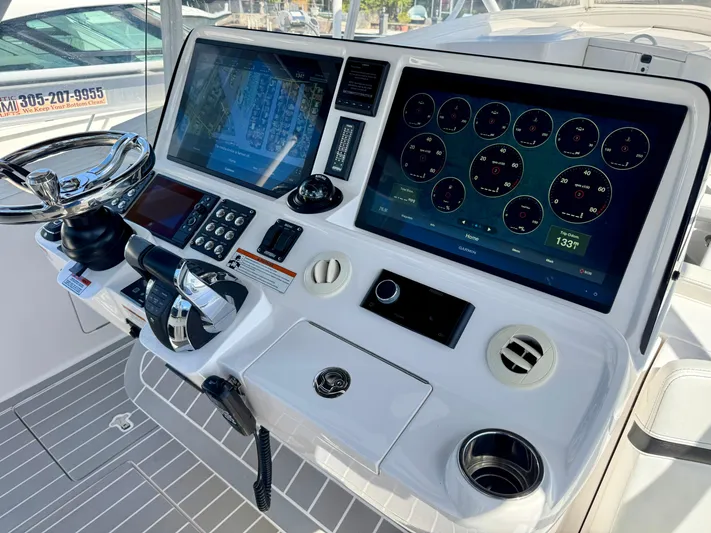  Yacht Photos Pics 2021 Intrepid 409 Valor boat dashboard with advanced navigation and control systems.