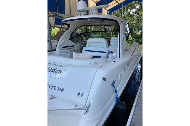 Co-motion Yacht Photos Pics 2008 Sea Ray 44 Sundancer yacht docked, featuring sleek white design and spacious seating.