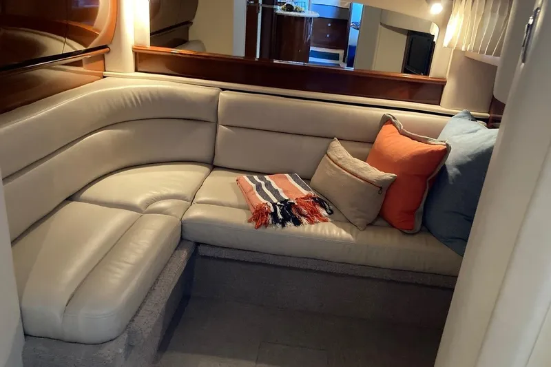 Co-motion Yacht Photos Pics Luxurious interior of 2008 Sea Ray 44 Sundancer with cozy seating and cushions.