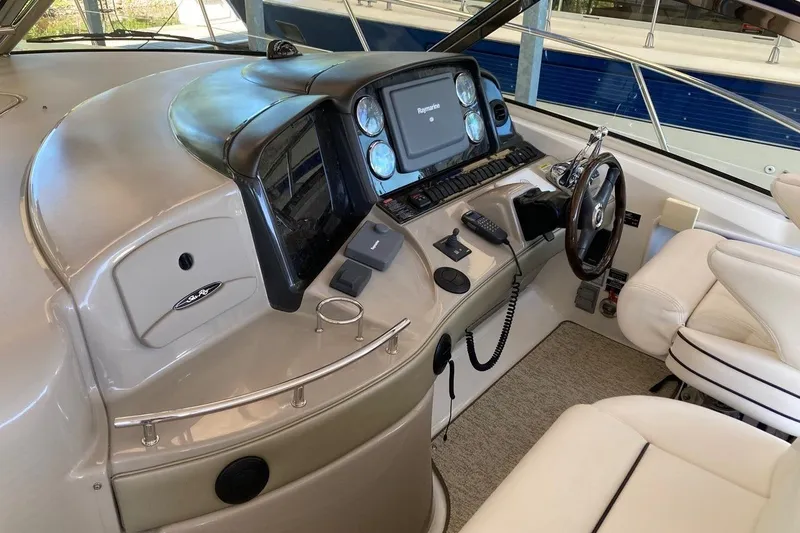 Co-motion Yacht Photos Pics 2008 Sea Ray 44 Sundancer helm with modern navigation equipment and luxurious seating.