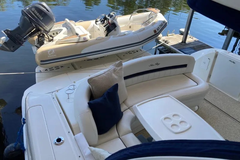 Co-motion Yacht Photos Pics 2008 Sea Ray 44 Sundancer with Zodiac tender and Yamaha motor, docked on calm water.