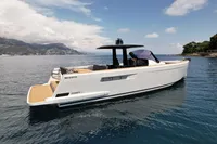 2020 Fjord 40 Open yacht on calm sea with scenic coastal backdrop.