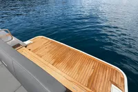 Luxury Fjord 40 Open 2020 yacht with teak deck on calm water.