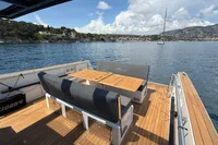 2020 Fjord 40 Open yacht with spacious deck, wooden seating, and scenic ocean view.