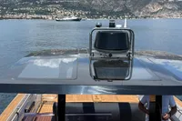 Fjord 40 Open 2020 yacht on calm water with scenic mountain backdrop.