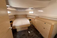 Luxurious cabin interior of 2020 Fjord 40 Open yacht with modern wood finish.