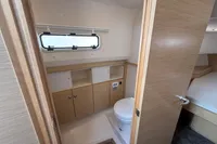 Modern bathroom interior on 2020 Fjord 40 Open yacht, featuring wood accents and compact design.