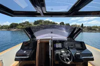 Cockpit view of 2020 Fjord 40 Open yacht with scenic waterfront backdrop.