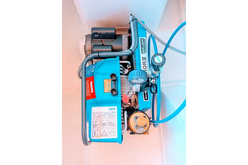 Momentum 42 Yacht Photos Pics 2023 Leopard 42 engine compartment with Bauer compressor and blue hoses.