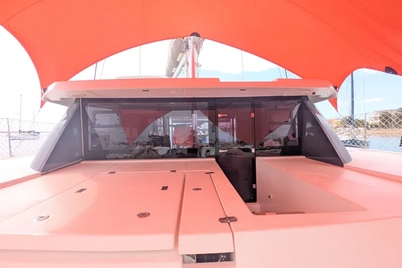 Momentum 42 Yacht Photos Pics 2023 Leopard 42 yacht with orange canopy, docked at marina.