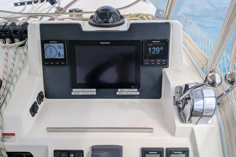 Momentum 42 Yacht Photos Pics Control panel of a 2023 Leopard 42 yacht with navigation instruments and throttle controls.