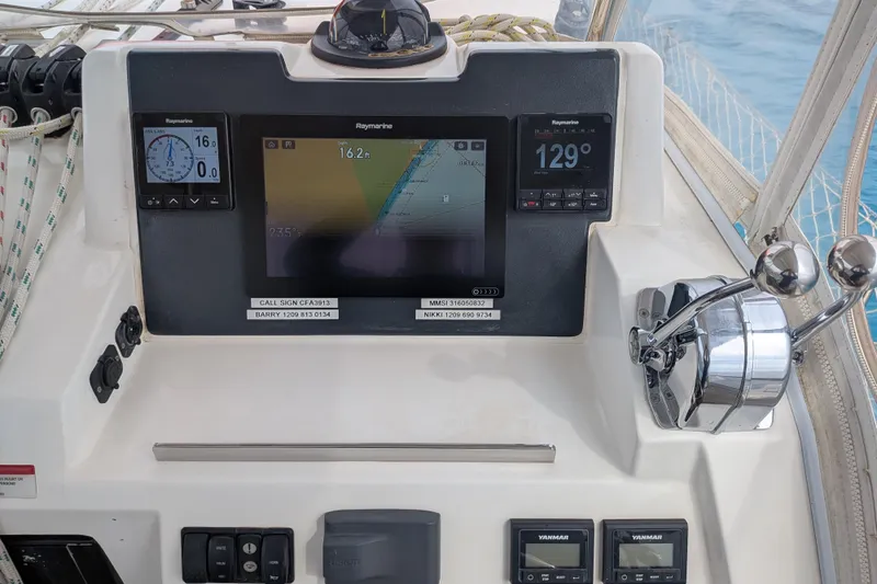 Momentum 42 Yacht Photos Pics Control panel of a 2023 Leopard 42 yacht with navigation displays and throttle controls.