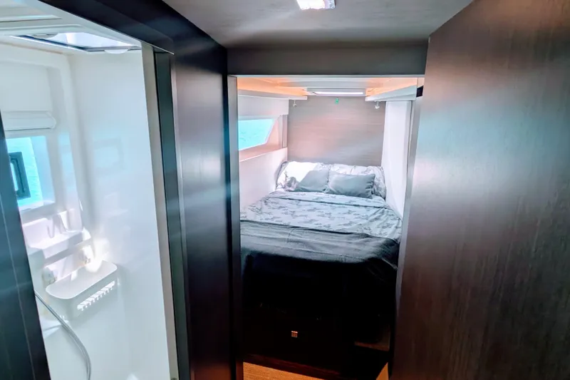 Momentum 42 Yacht Photos Pics Luxurious bedroom interior of 2023 Leopard 42 yacht with modern design and ocean view.