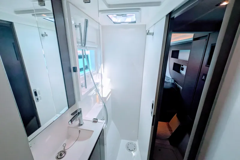 Momentum 42 Yacht Photos Pics Modern bathroom interior on 2023 Leopard 42 yacht, featuring sleek design and compact layout.