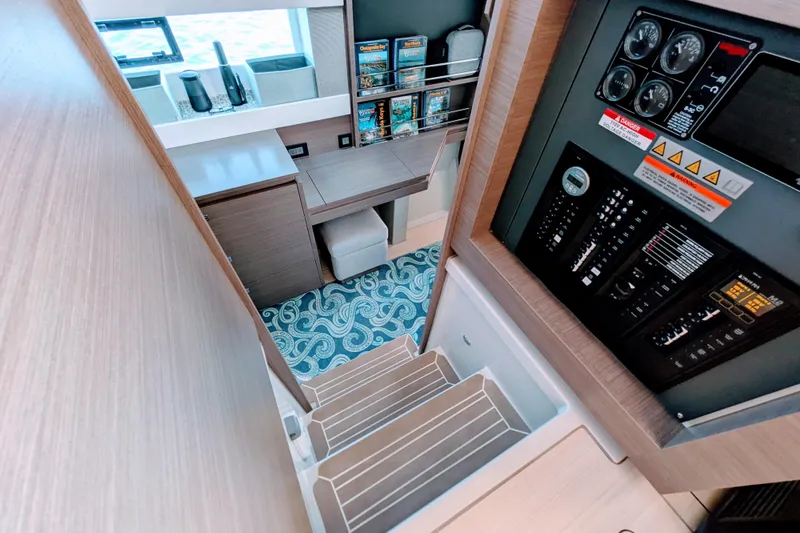 Momentum 42 Yacht Photos Pics Modern Leopard 42 yacht interior with control panel, desk, and patterned carpet, 2023 model.