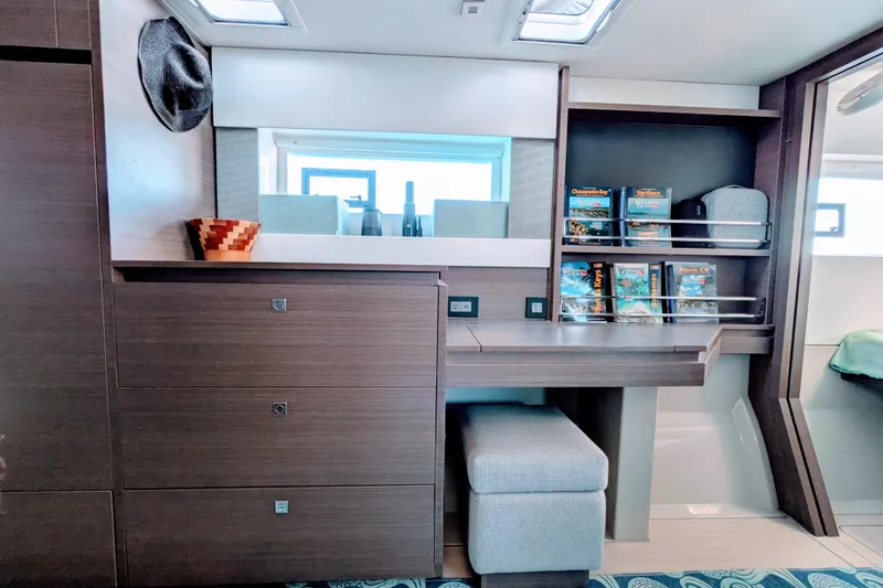 Momentum 42 Yacht Photos Pics Modern interior of 2023 Leopard 42 yacht with sleek cabinetry and cozy seating.