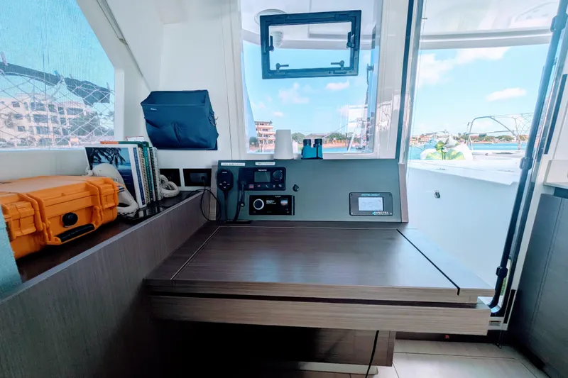 Momentum 42 Yacht Photos Pics 2023 Leopard 42 yacht interior with navigation station and outdoor view.