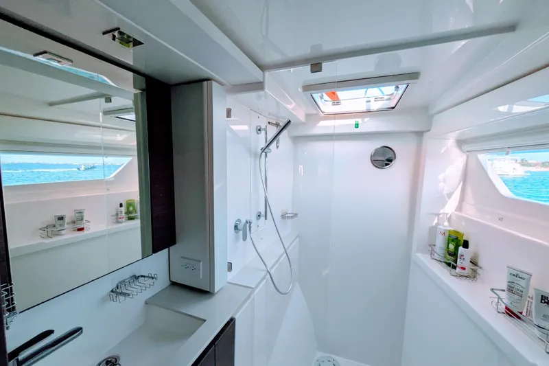 Momentum 42 Yacht Photos Pics Luxurious bathroom in 2023 Leopard 42 yacht with modern fixtures and ocean view.