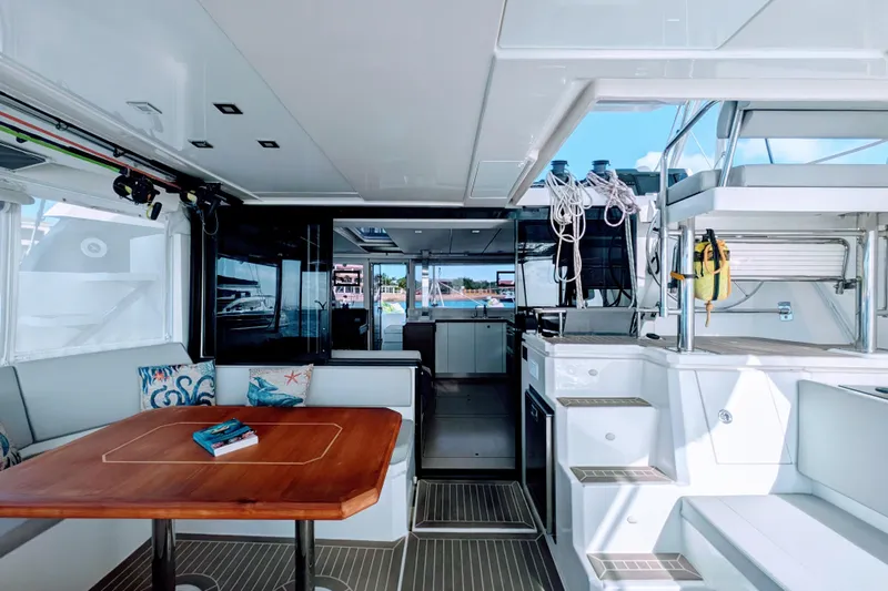 Momentum 42 Yacht Photos Pics Luxurious interior of 2023 Leopard 42 catamaran with modern seating and dining area.