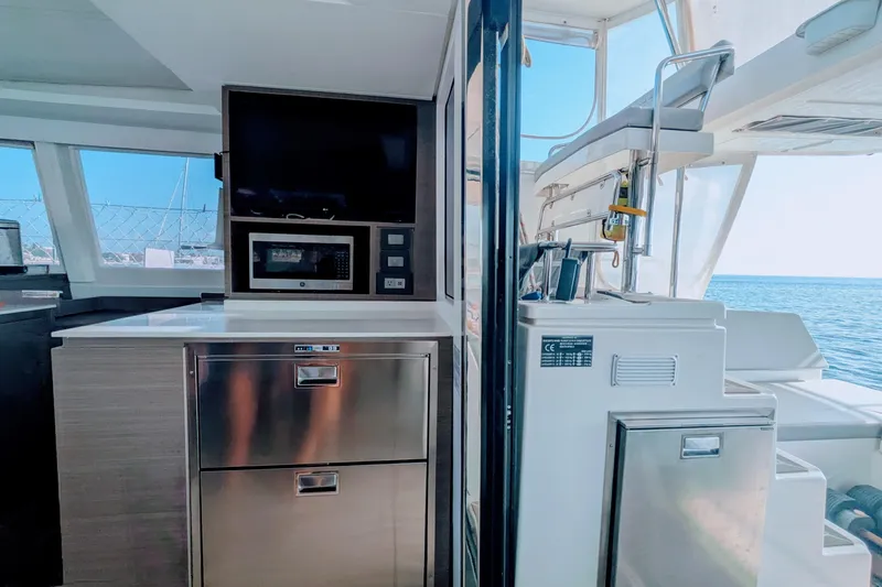 Momentum 42 Yacht Photos Pics Modern kitchen area on 2023 Leopard 42 yacht with ocean view.