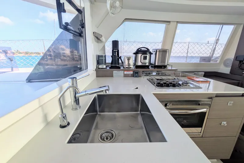 Momentum 42 Yacht Photos Pics Modern kitchen in 2023 Leopard 42 yacht with appliances and ocean view.