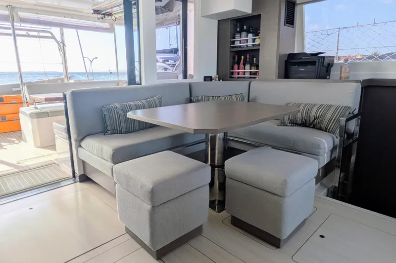 Momentum 42 Yacht Photos Pics Modern interior of 2023 Leopard 42 yacht with cozy seating and ocean view.