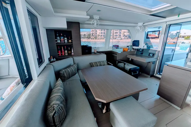 Momentum 42 Yacht Photos Pics Luxurious interior of 2023 Leopard 42 yacht with modern seating and bar area.