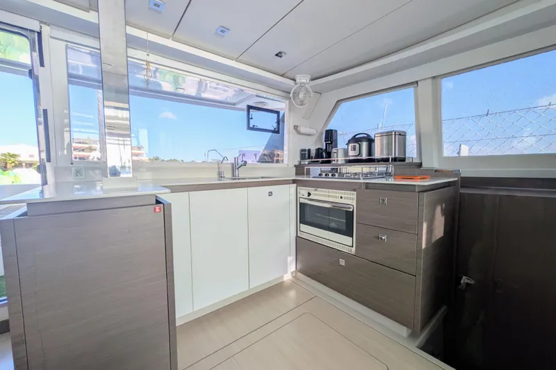 Momentum 42 Yacht Photos Pics Modern kitchen interior on 2023 Leopard 42 yacht, featuring sleek appliances and ample natural light.