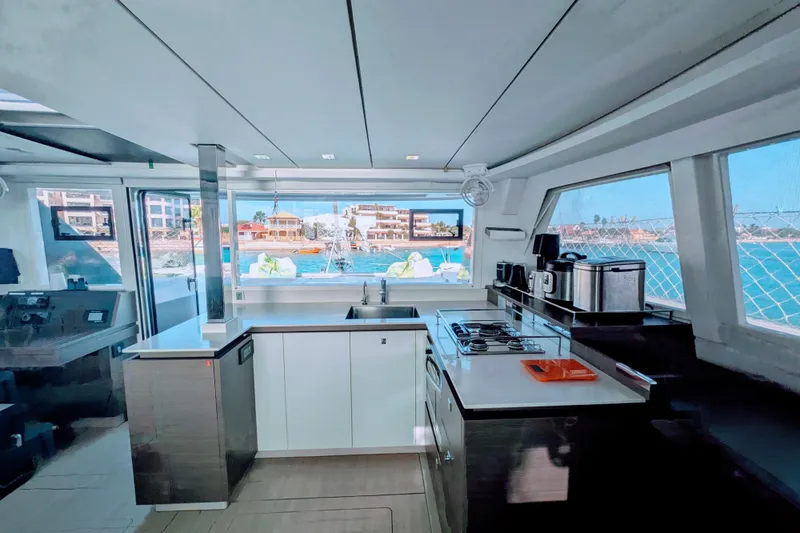 Momentum 42 Yacht Photos Pics Modern kitchen interior of 2023 Leopard 42 yacht with ocean view.