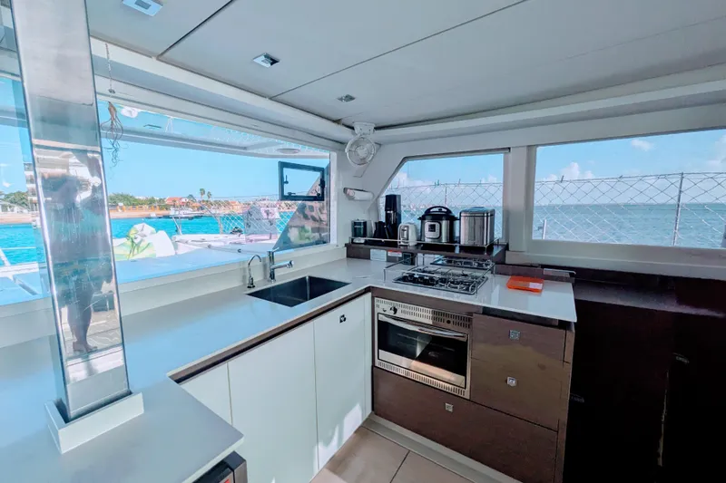 Momentum 42 Yacht Photos Pics Modern kitchen interior on 2023 Leopard 42 yacht with ocean view.