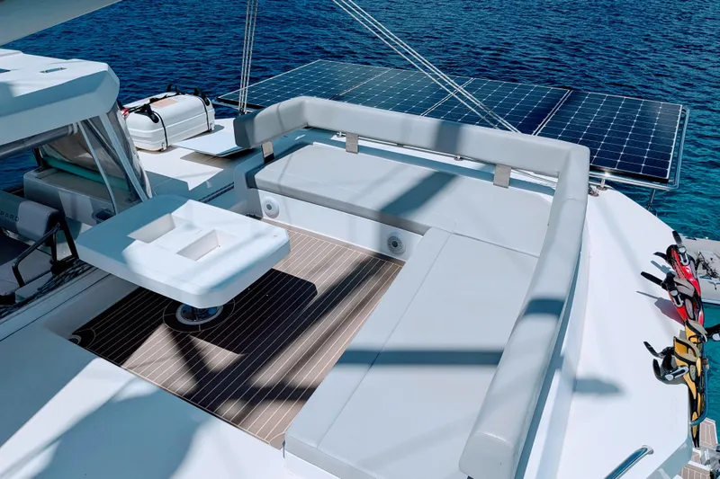 Momentum 42 Yacht Photos Pics Luxurious Leopard 42 catamaran deck with solar panels, 2023 model, overlooking serene blue waters.