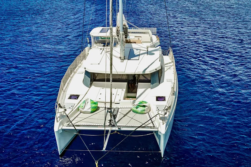 Momentum 42 Yacht Photos Pics 2023 Leopard 42 catamaran sailing on vibrant blue ocean waters.